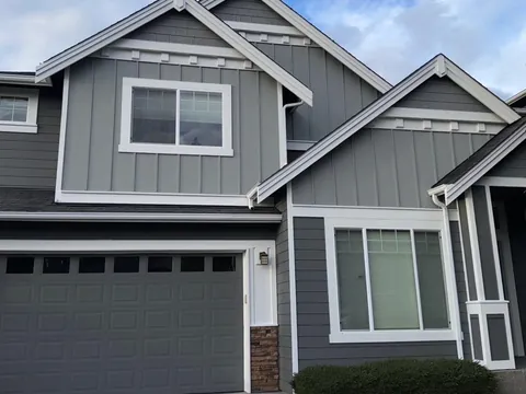 After: exterior house painting before and after, craftsman home repainted from yellow to gray in Snohomish County
