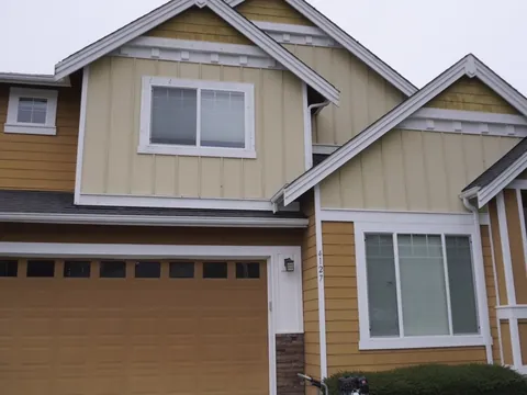 Before: exterior house painting before and after, craftsman home repainted from yellow to gray in Snohomish County