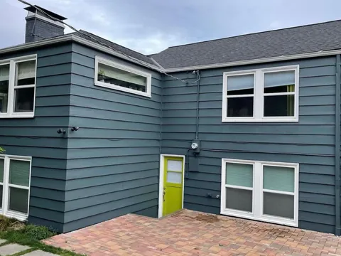 After: peeling exterior paint scraped, primed and repainted